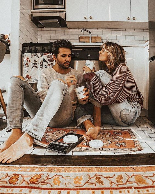couple on floor with ice cream for date night at home
